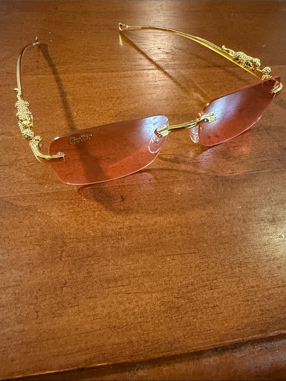 Cartier Rimless Sunglasses with Rose-Tinted Lenses and Gold Temples